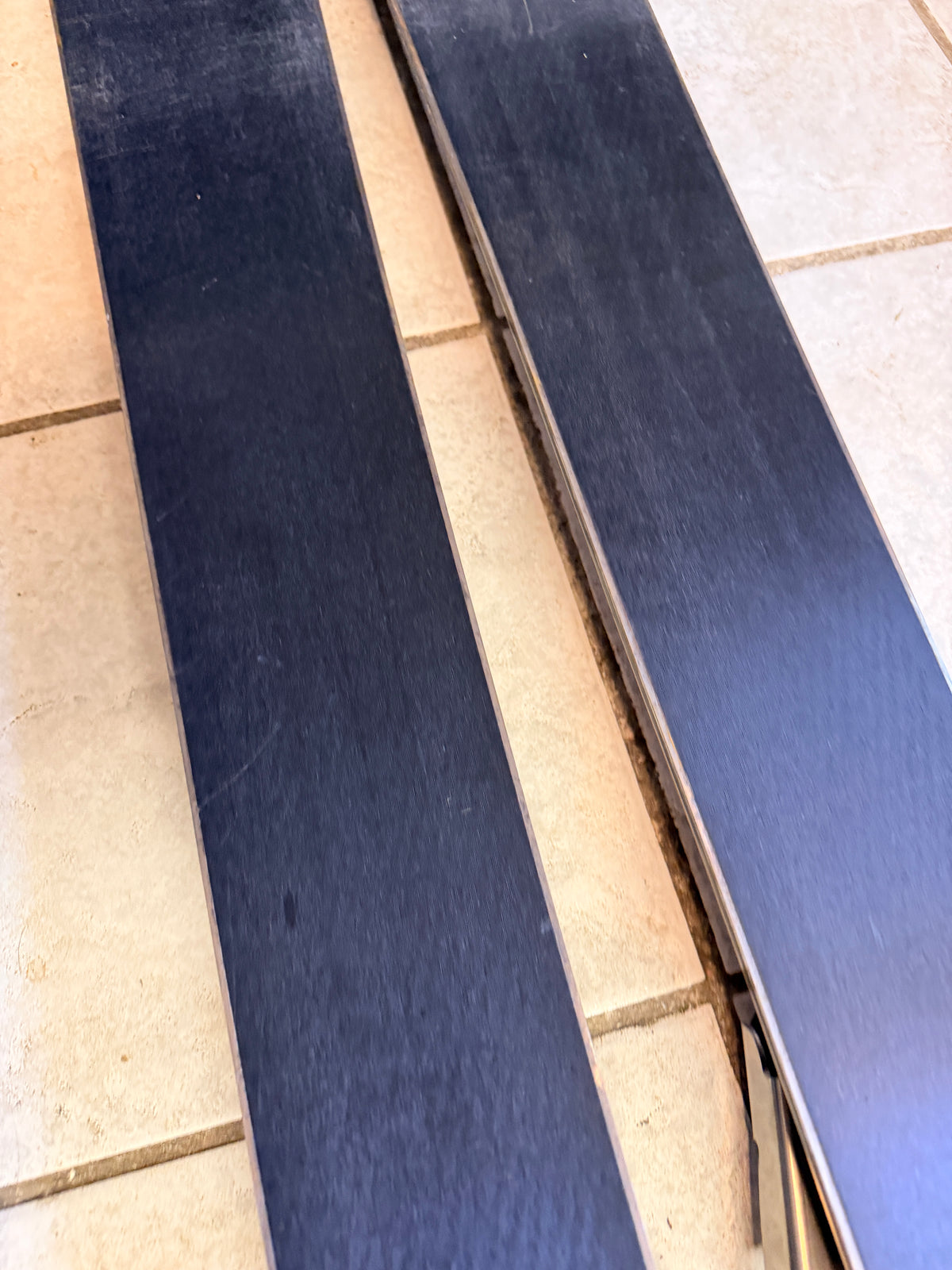 Detail view of the bases and edges of the used skis
