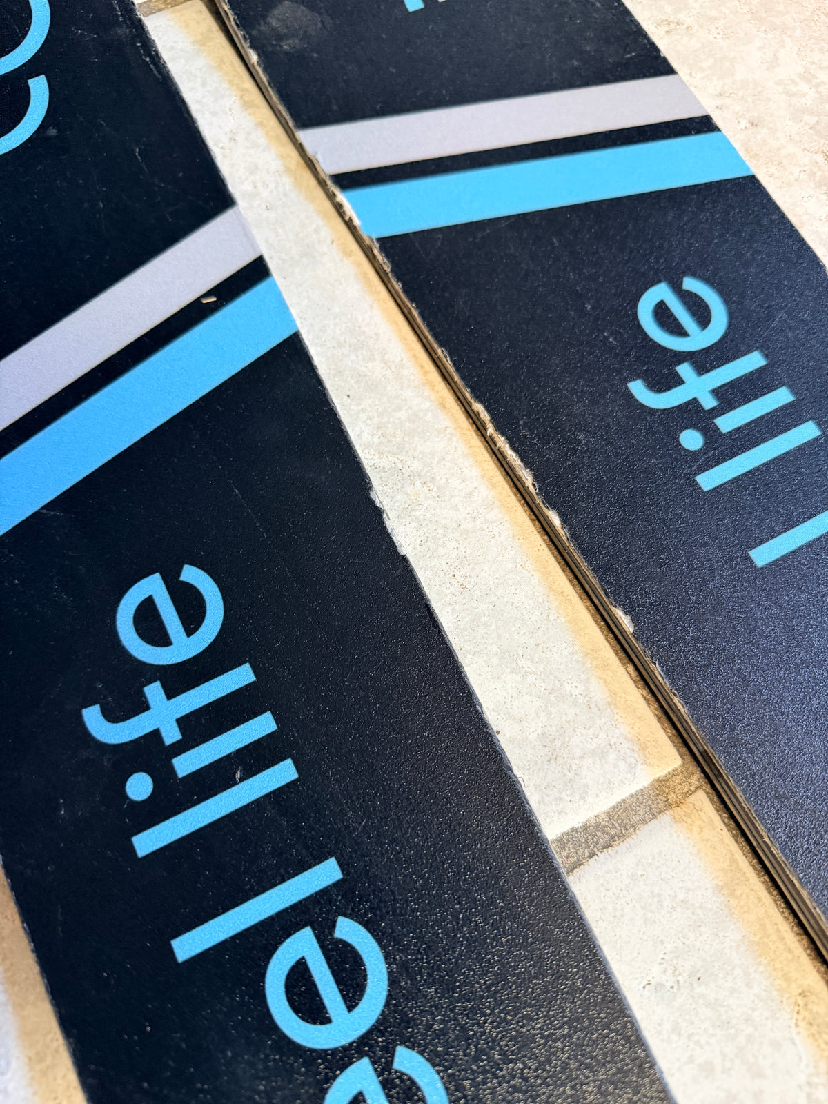 Close-up of topsheet graphics near the ski tips