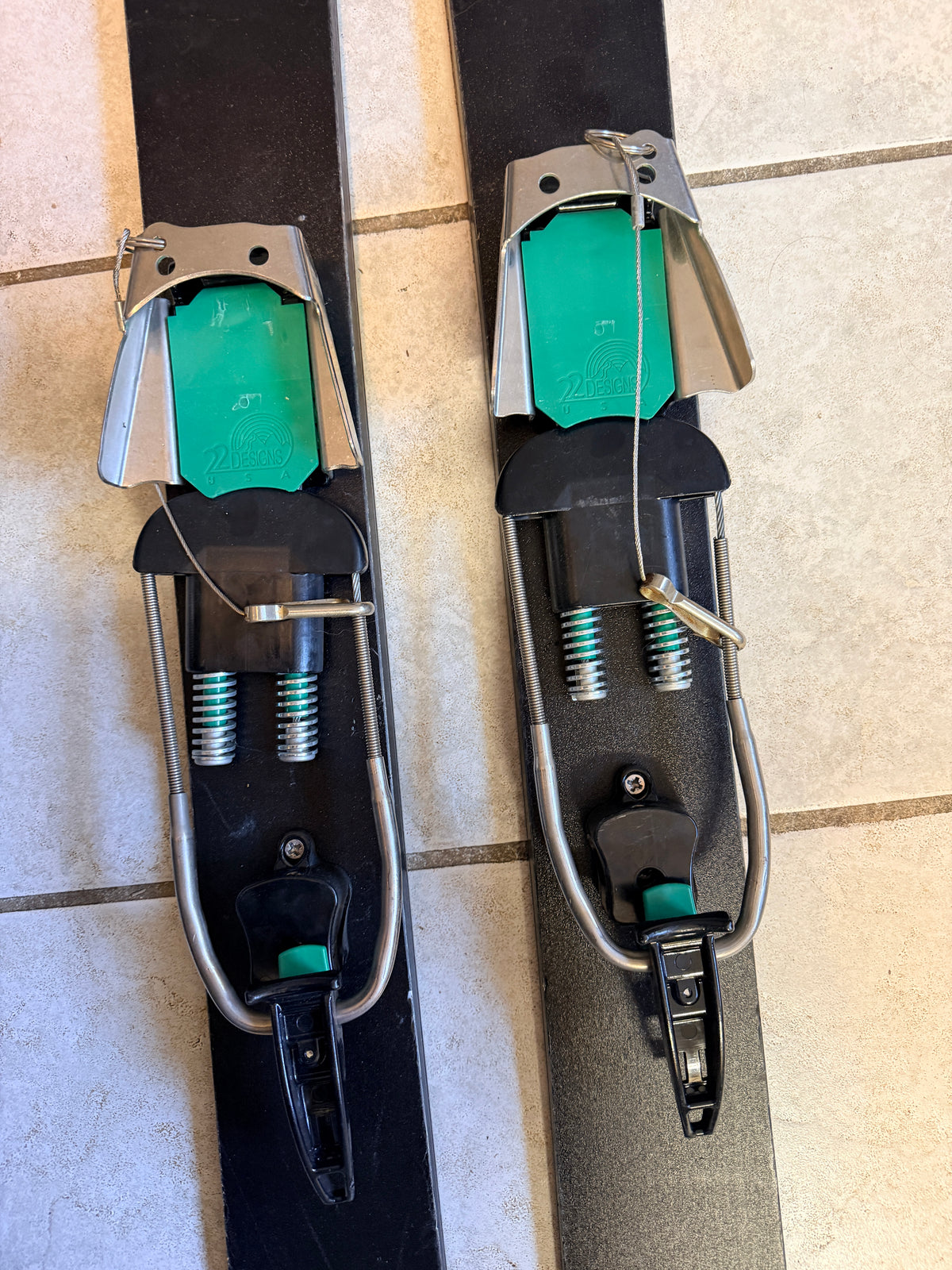 Close-up of Freeheel Life logos on both ski topsheets