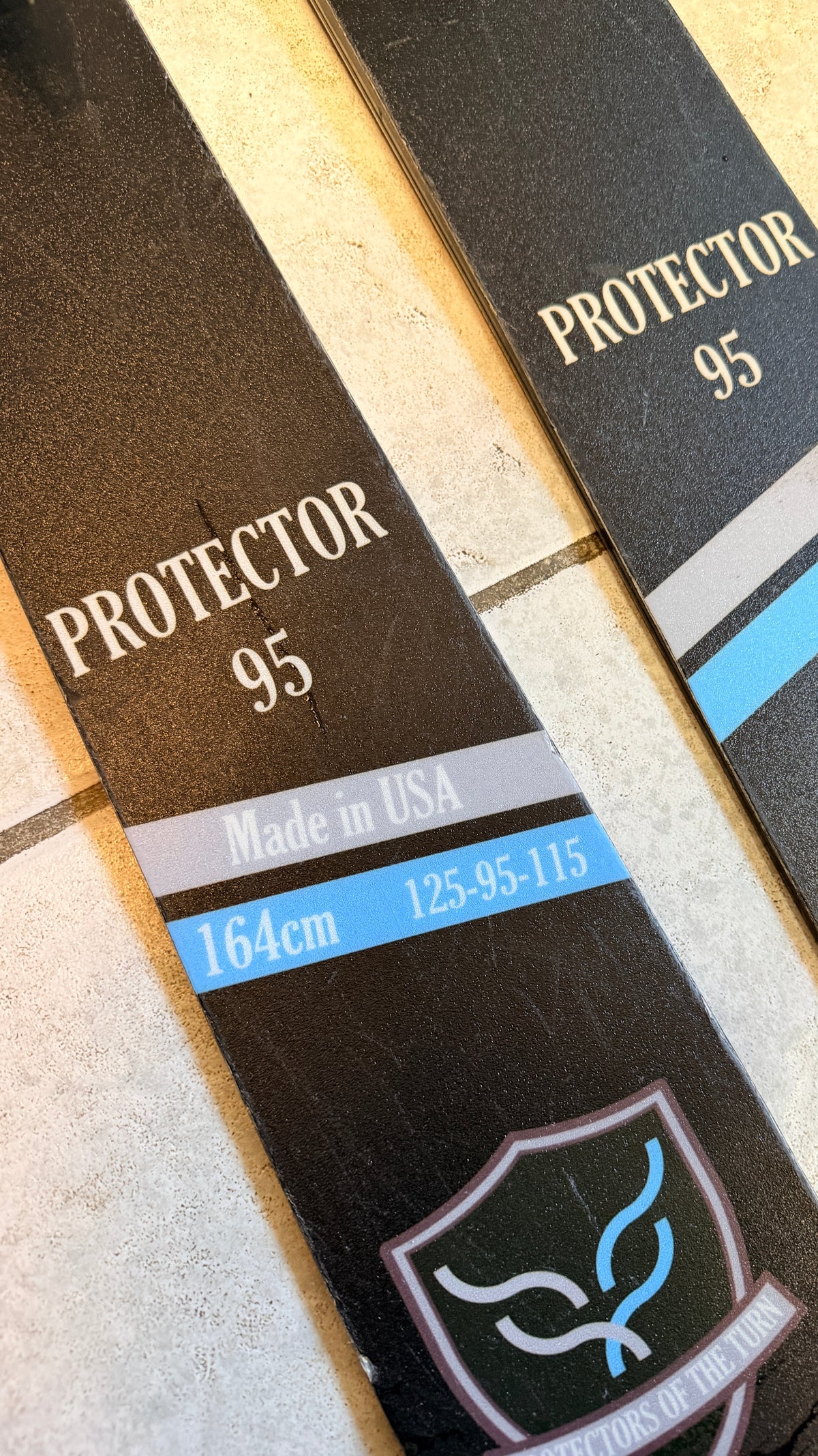 Close-up of Protector 95 ski tail graphics and wear