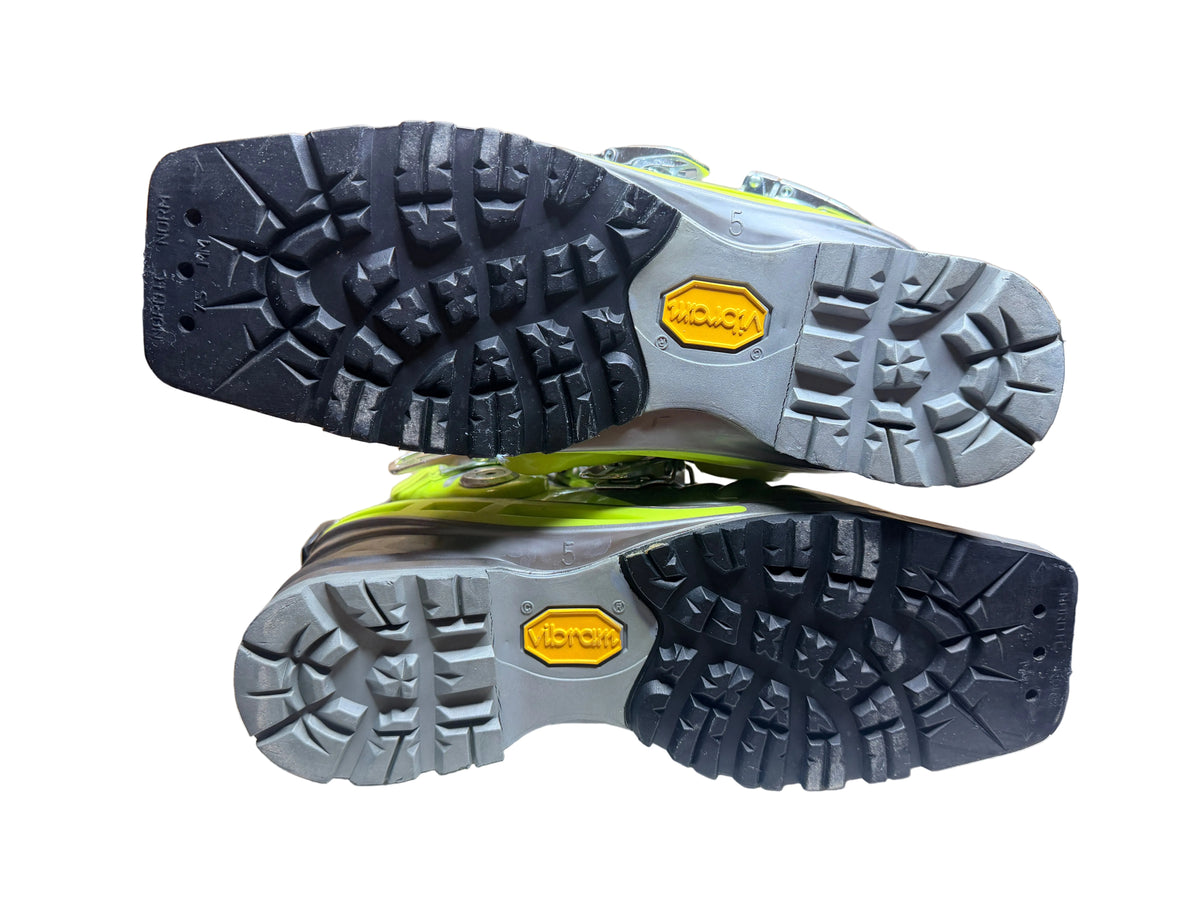 Both used Scarpa T1 boot soles showing tread and wear